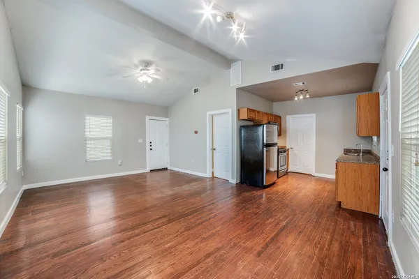 a view of a livingroom with wooden floor
