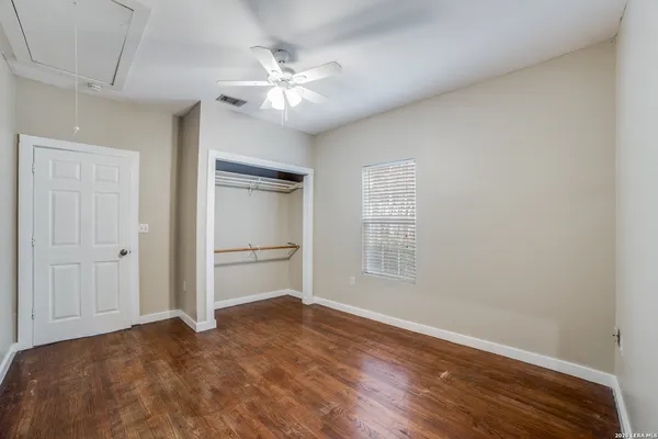 a view of an empty room with a bathroom