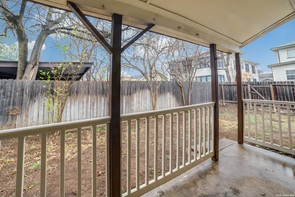 a view of a house with a yard and pathway
