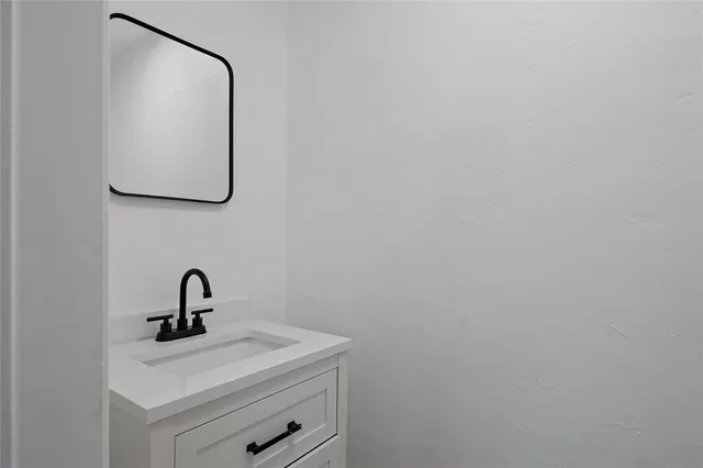 a view of a bathroom from the hallway