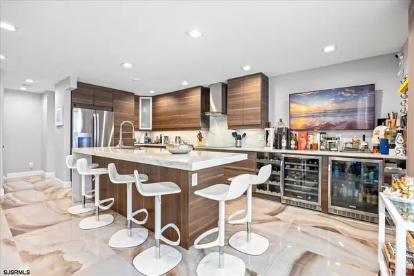 a kitchen with stainless steel appliances granite countertop a sink and a stove
