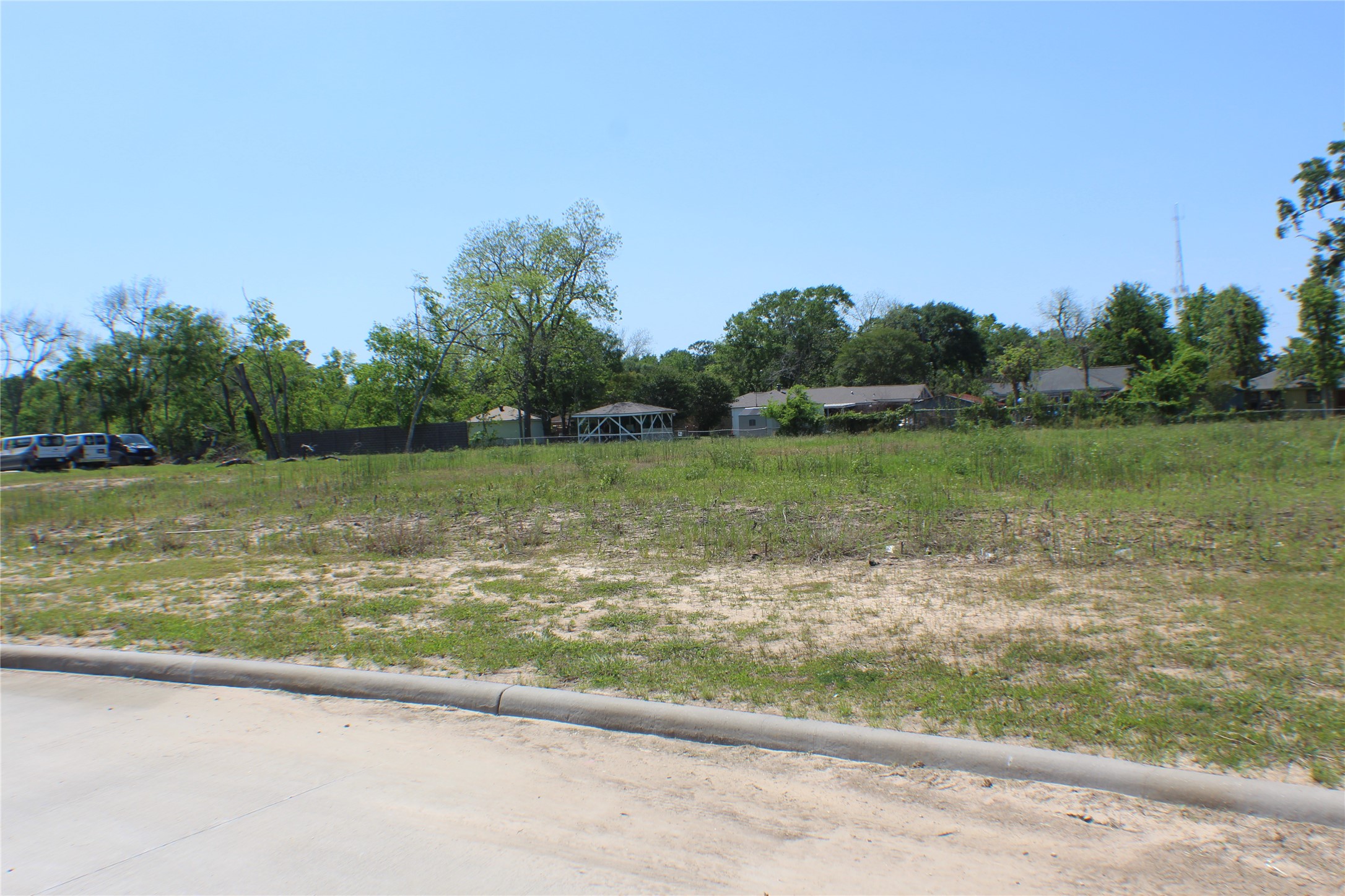 89 Isaacks Road Humble, TX 77338 - Photo 10 of 12 a view of a lake with a yard