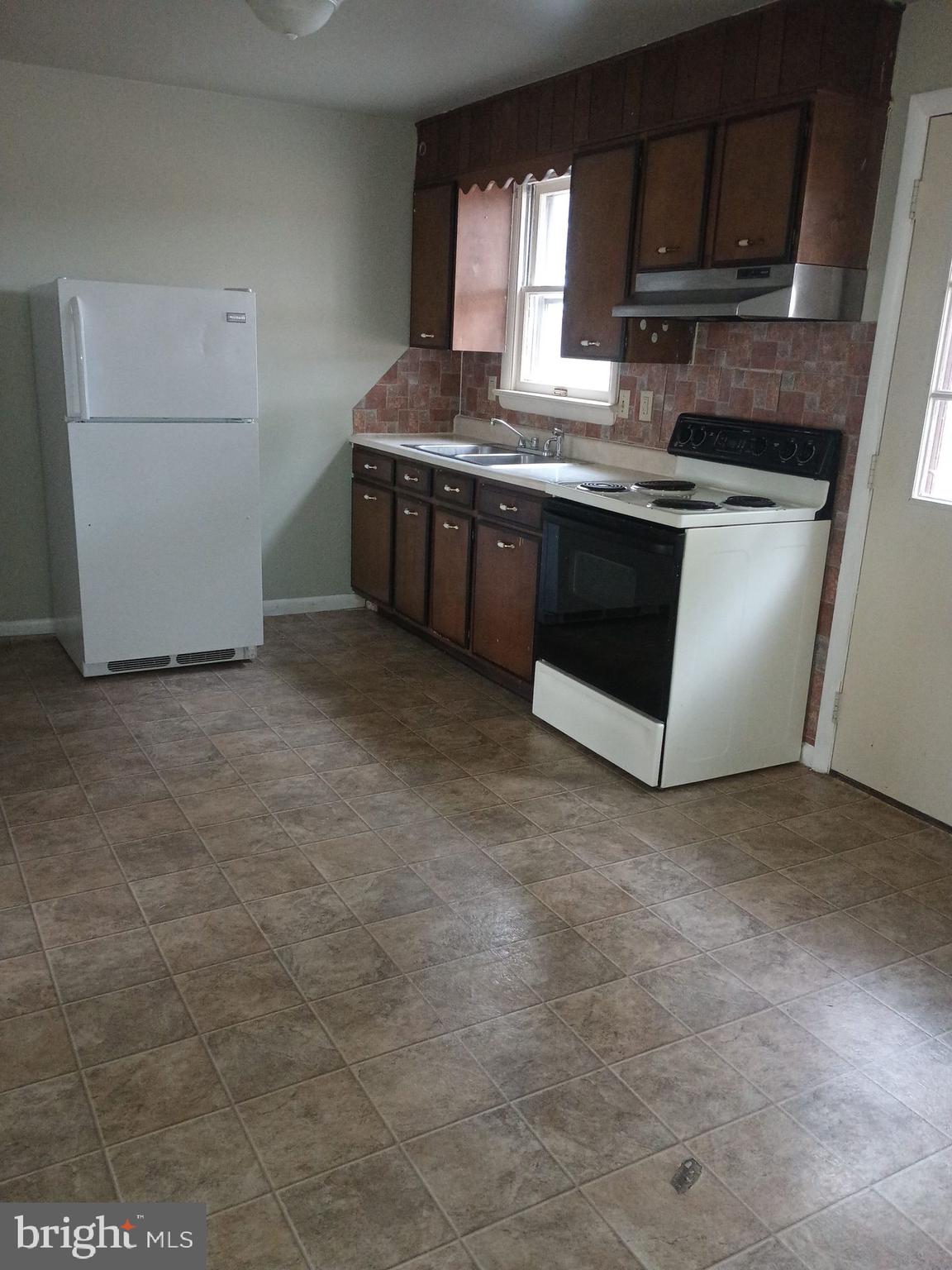 2627 Bainbridge Road, Unit C Bainbridge, PA 17502 - Photo 2 of 11 a kitchen with stainless steel appliances granite countertop a stove a sink and a microwave
