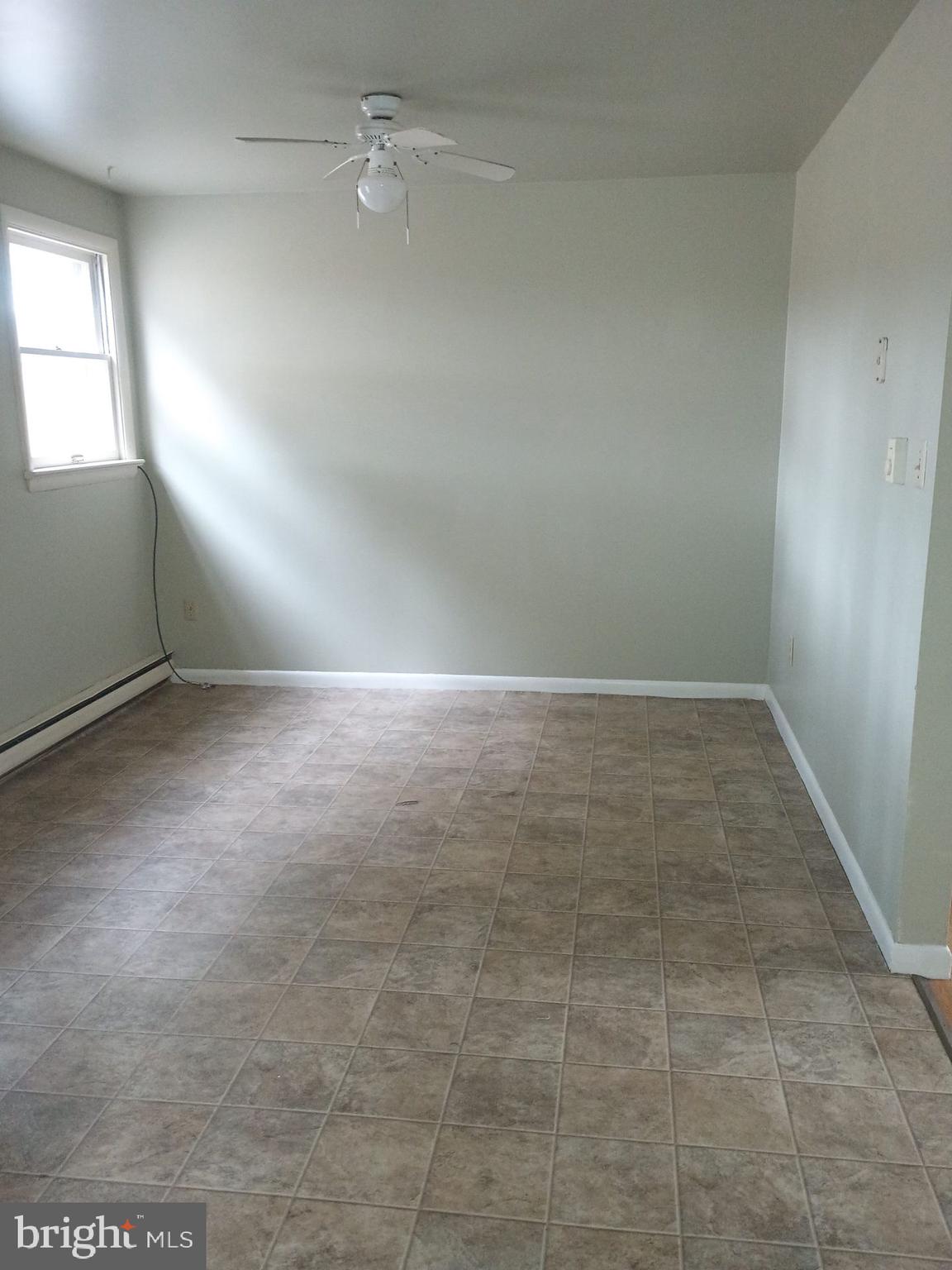 2627 Bainbridge Road, Unit C Bainbridge, PA 17502 - Photo 4 of 11 an empty room with windows and entrance