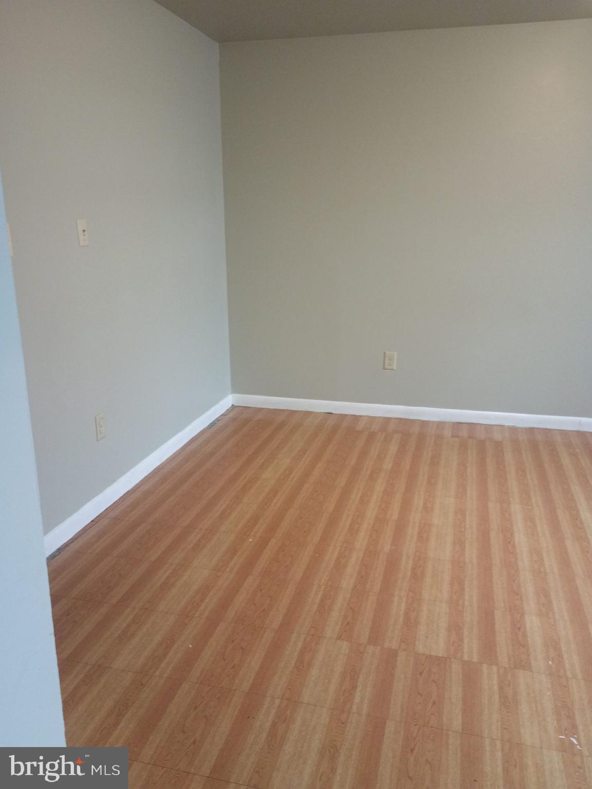 2627 Bainbridge Road, Unit C Bainbridge, PA 17502 - Photo 9 of 11 a view of an empty room with wooden floor and a window
