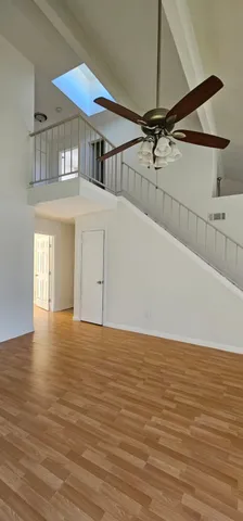 a view of an ocean with a ceiling fan