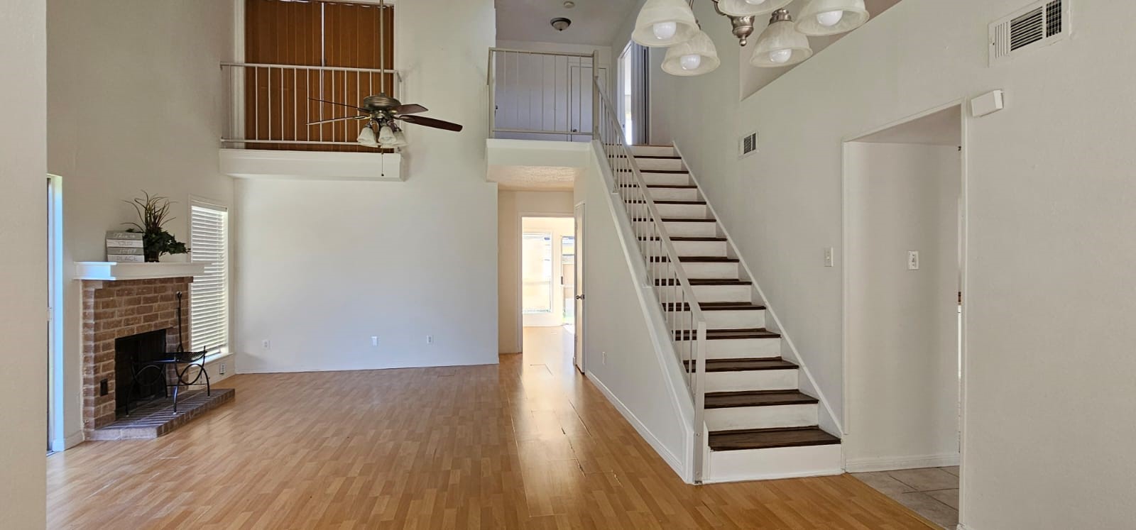 11841 Spring Grove Drive Houston, TX 77099 - Photo 5 of 28 a view of a livingroom with wooden floor and stairs