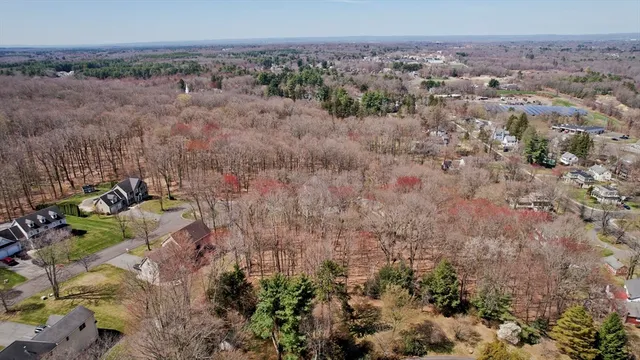 an aerial view of house with yard