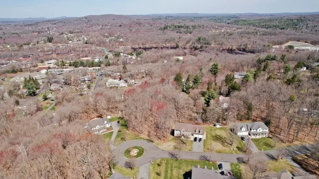an aerial view of house with yard