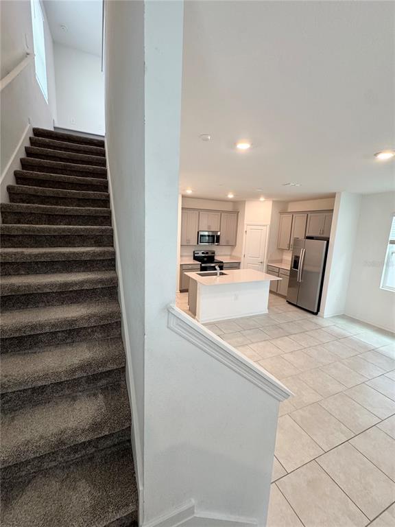 6473 Pine Warbler Way St. Cloud, FL 34771 - Photo 11 of 27 a view of kitchen with sink and refrigerator