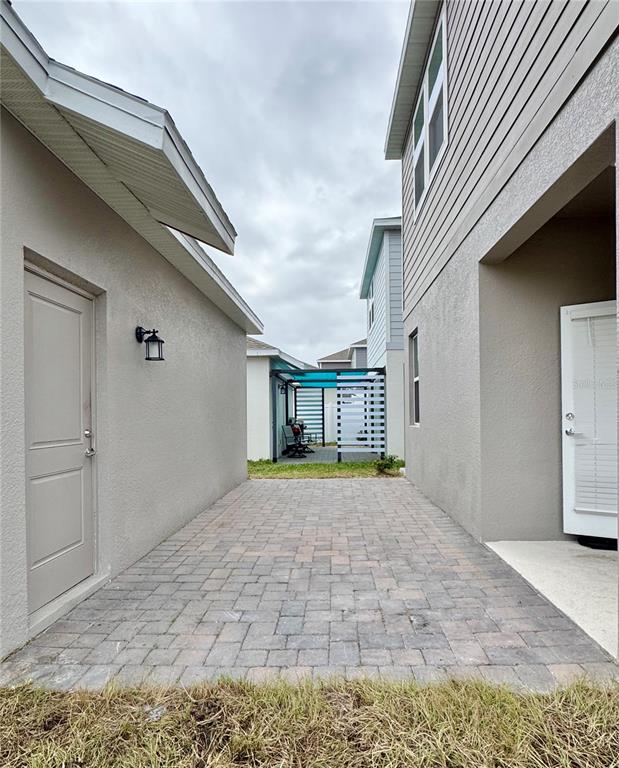 6473 Pine Warbler Way St. Cloud, FL 34771 - Photo 24 of 27 a view of a house with a porch