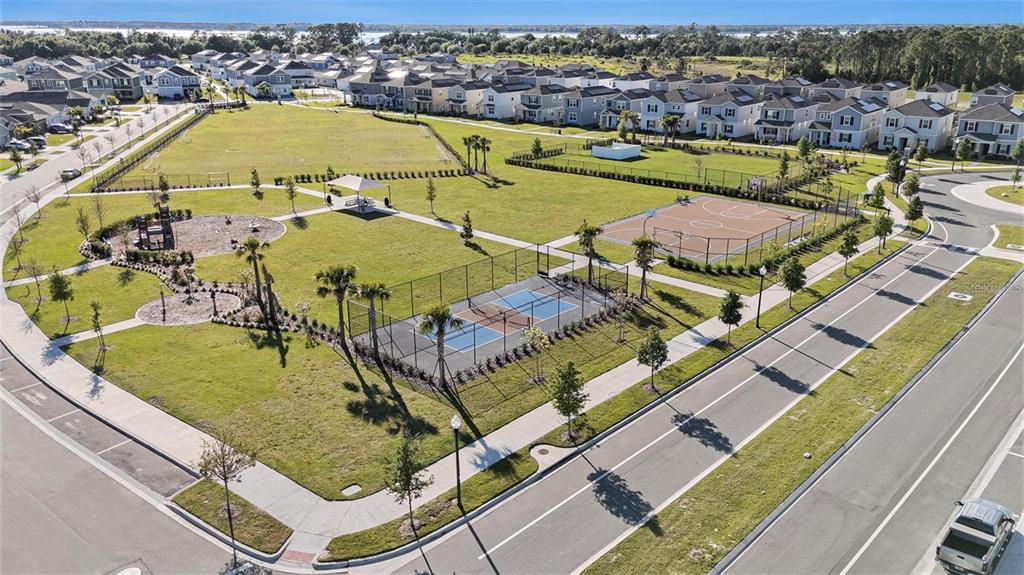 6473 Pine Warbler Way St. Cloud, FL 34771 - Photo 26 of 27 an aerial view of a house with a swimming pool