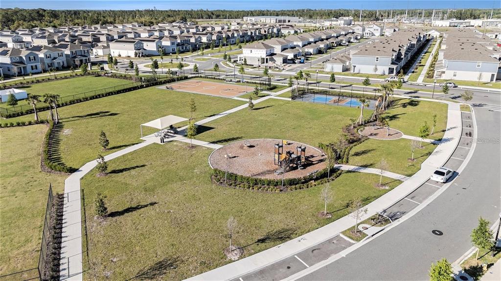 6473 Pine Warbler Way St. Cloud, FL 34771 - Photo 27 of 27 a view of a swimming pool with a lake