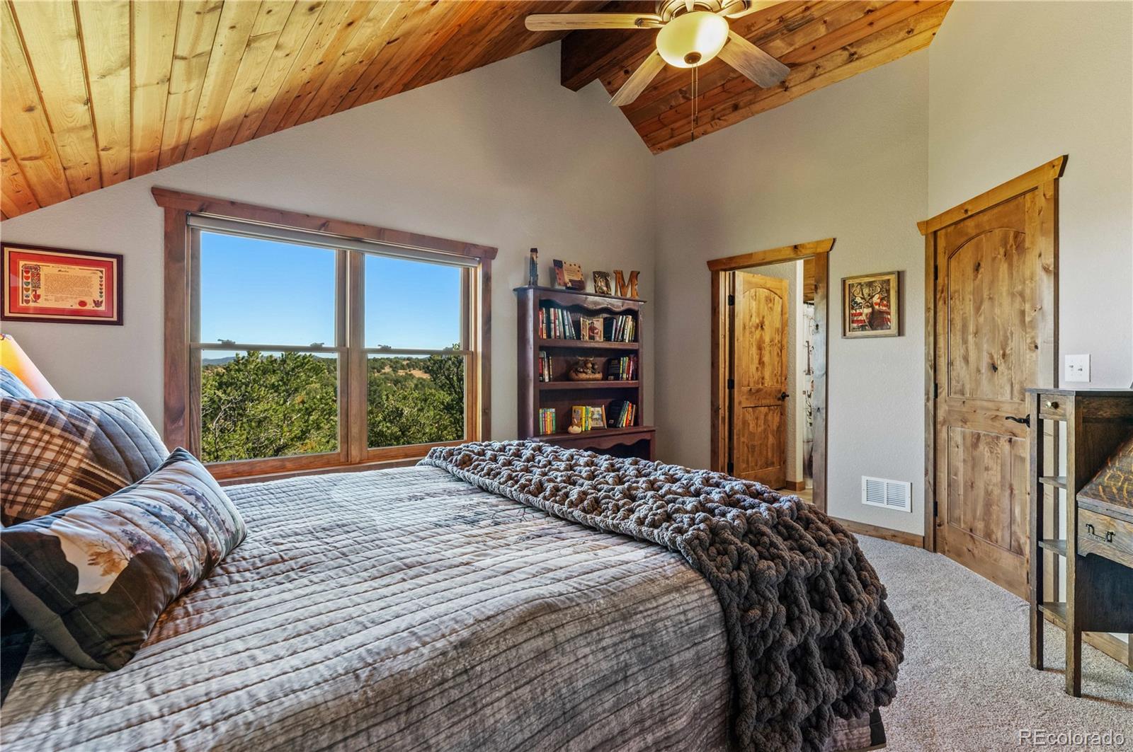 1310 Sunrise Ridge Cotopaxi, CO 81223 - Photo 43 of 50 a bed sitting in a bedroom next to a window