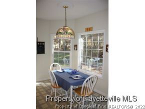 1550 Reservation Road Aberdeen, NC 28315 - Photo 4 of 7 a view of a dining room with furniture window and outside view