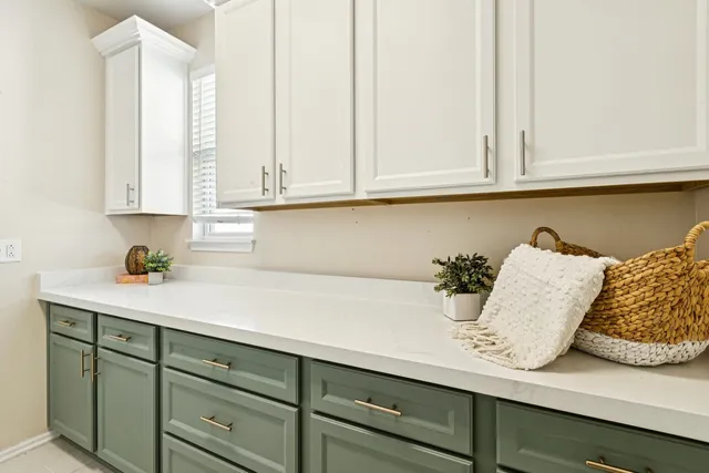 a kitchen with a sink and a large window