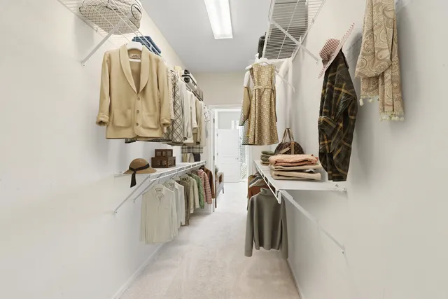 a room with pool table and windows