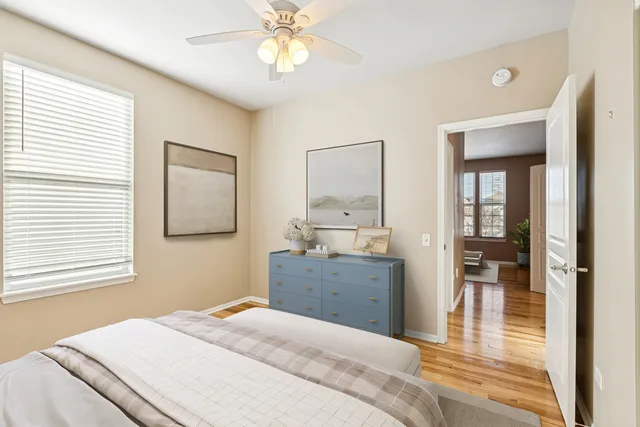 a bedroom with a large bed and a large window