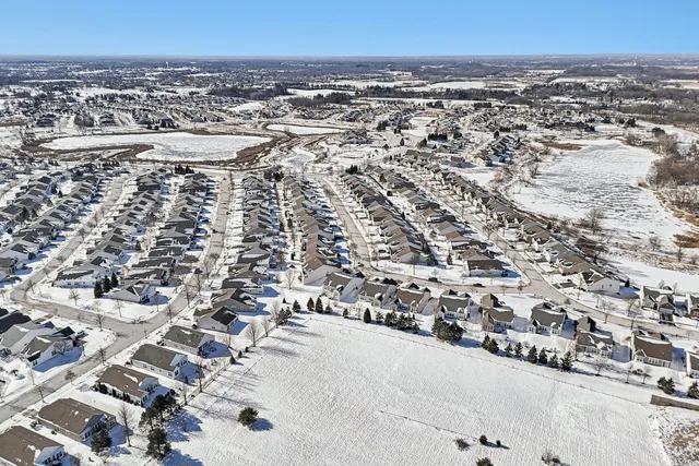 an aerial view of residential houses with outdoor space