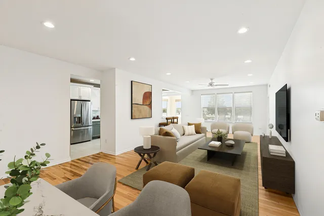 a living room with furniture window and a flat screen tv