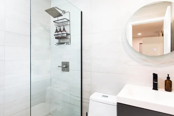 a bathroom with a sink and mirror
