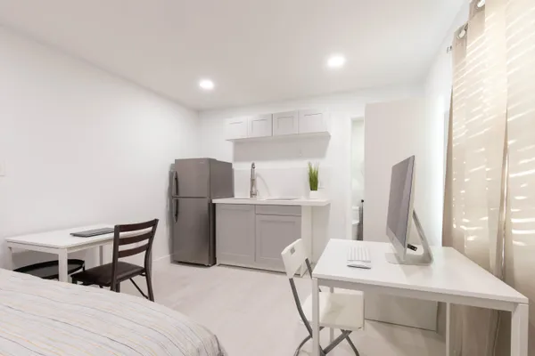 a bedroom with a bed and a table in it