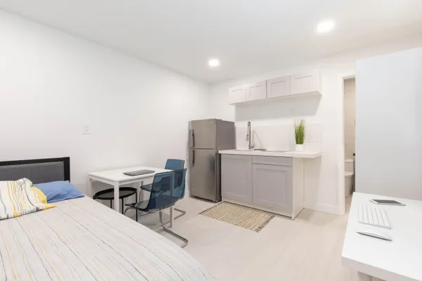 a room with a bed and furniture