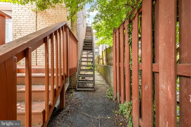 a view of wooden balcony with stairs