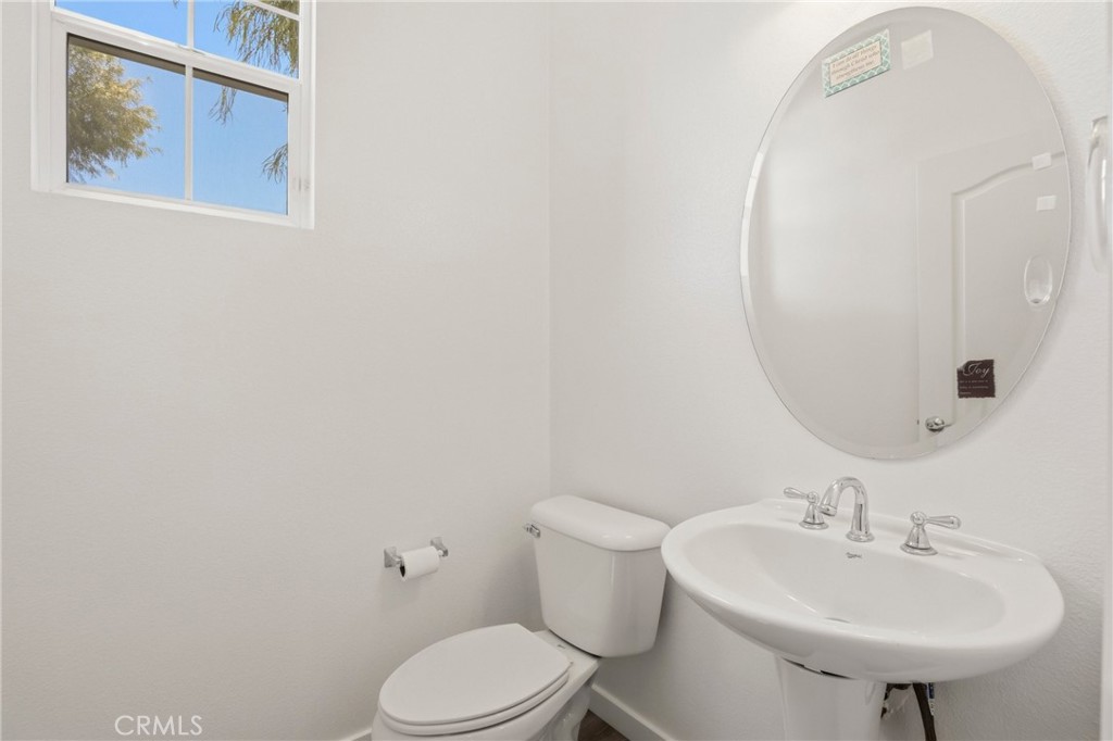 31598-31598 Six Rivers Court Temecula, CA 92592 - Photo 21 of 43 a bathroom with a sink mirror and toilet