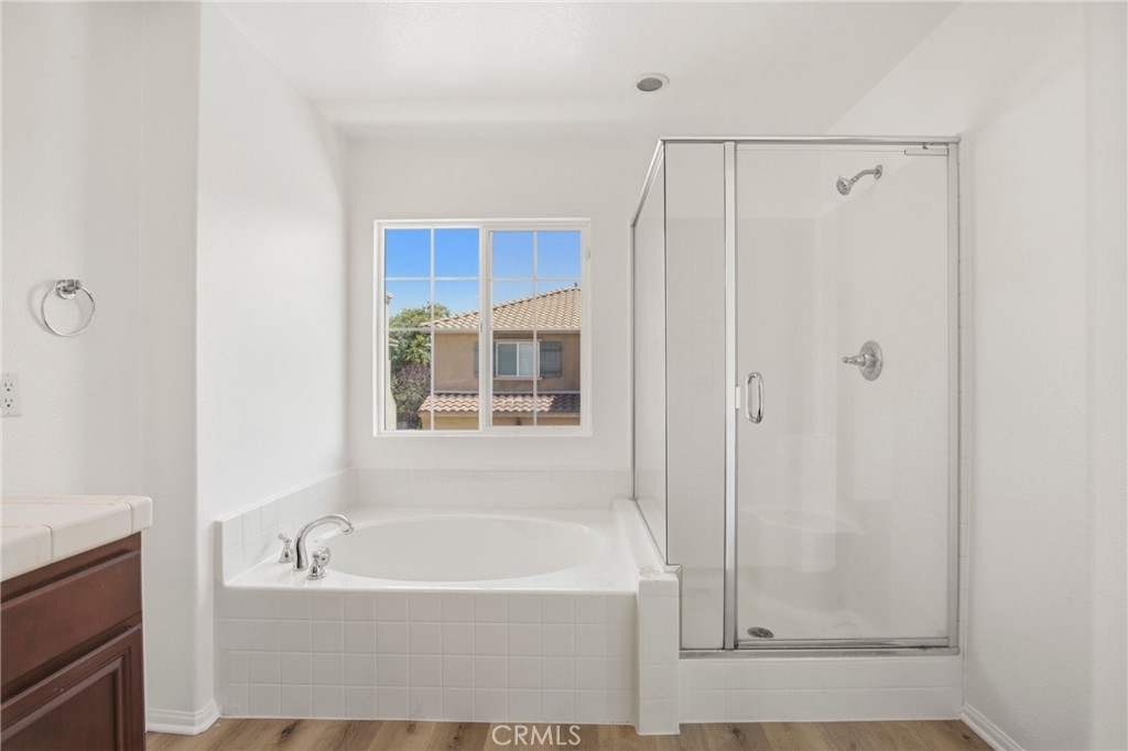 31598-31598 Six Rivers Court Temecula, CA 92592 - Photo 27 of 43 a bathroom with a bathtub and a shower