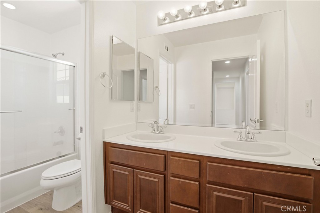 31598-31598 Six Rivers Court Temecula, CA 92592 - Photo 35 of 43 a bathroom with a sink a toilet and shower