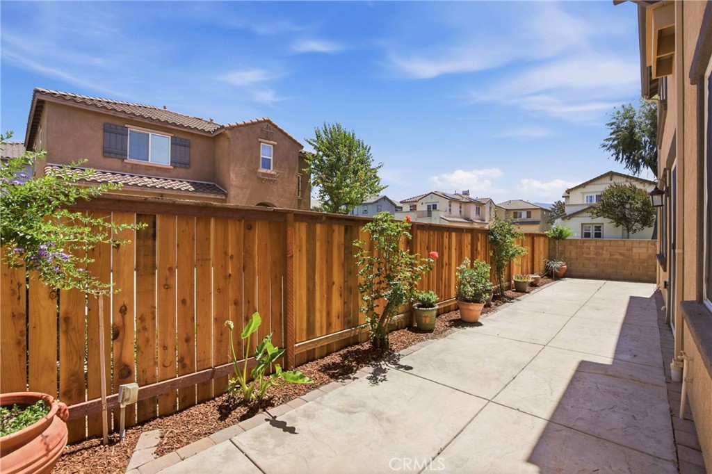 31598-31598 Six Rivers Court Temecula, CA 92592 - Photo 38 of 43 a view of a brick house with many windows