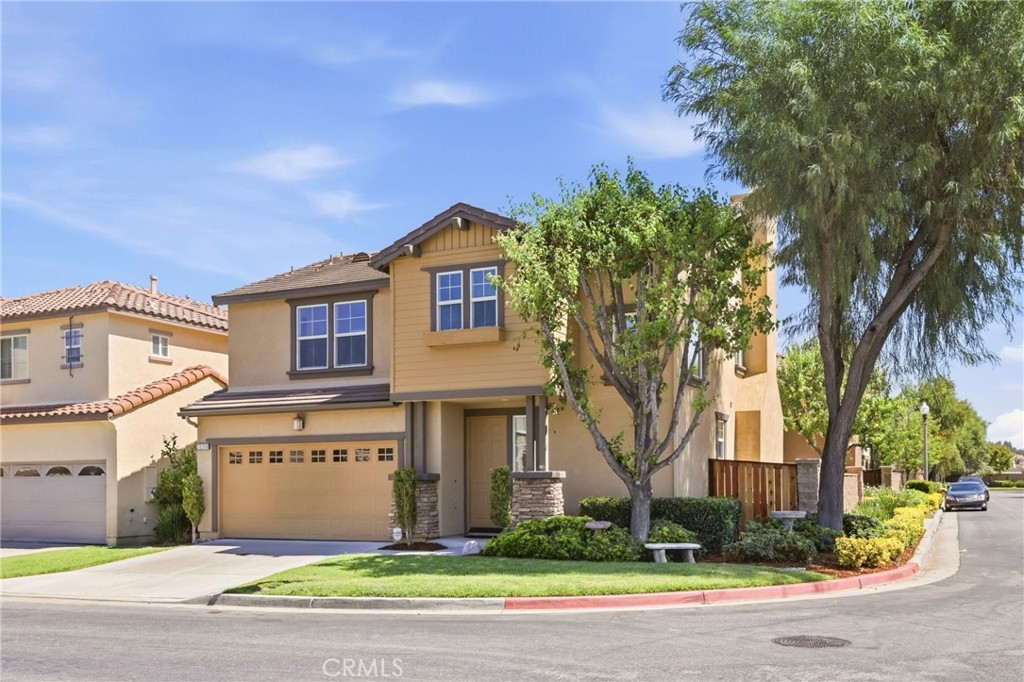 31598-31598 Six Rivers Court Temecula, CA 92592 - Photo 4 of 43 a front view of a house with a yard and garage