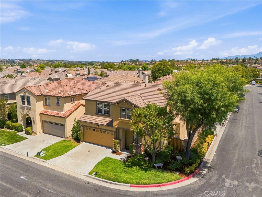 31598-31598 Six Rivers Court Temecula, CA 92592 - Photo 41 of 43 an aerial view of a house with a garden and lake view