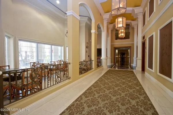 a living room with furniture a rug and a fireplace