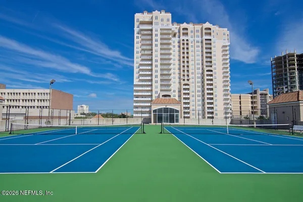 a view of roof deck with chairs and wooden floor
