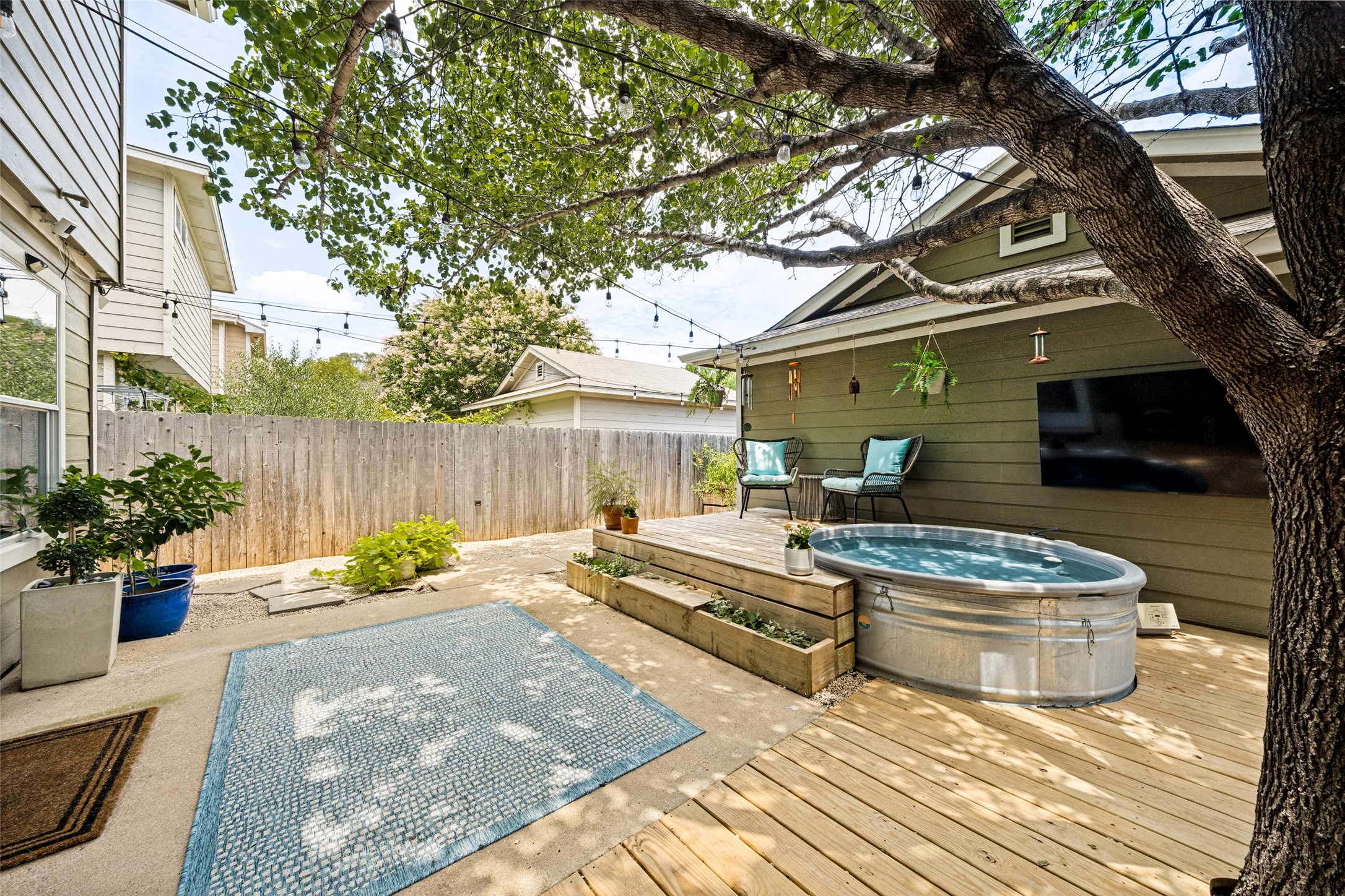 9205 Rowlands Sayle Road Austin, TX 78744 - Photo 22 of 25 A private outdoor space with a charming deck and relaxing spa.