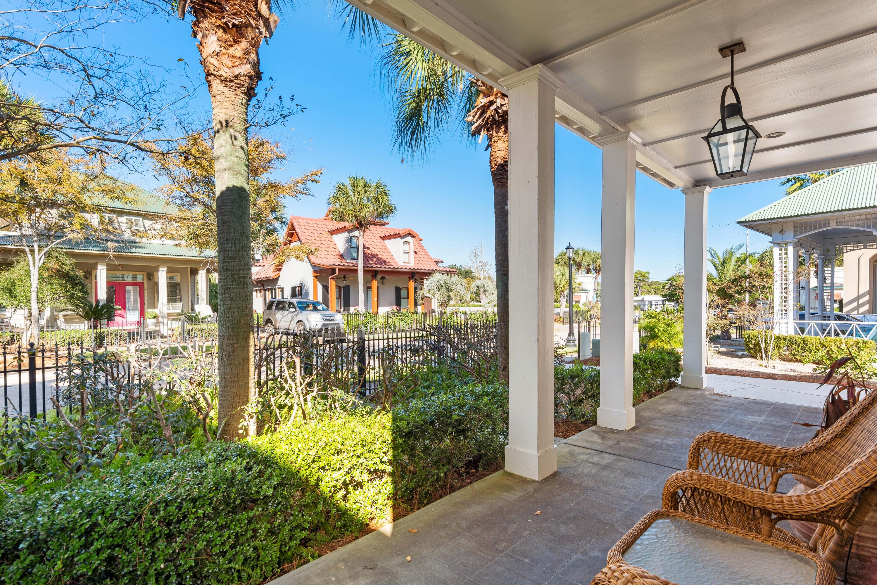 a front view of a house with outdoor seating