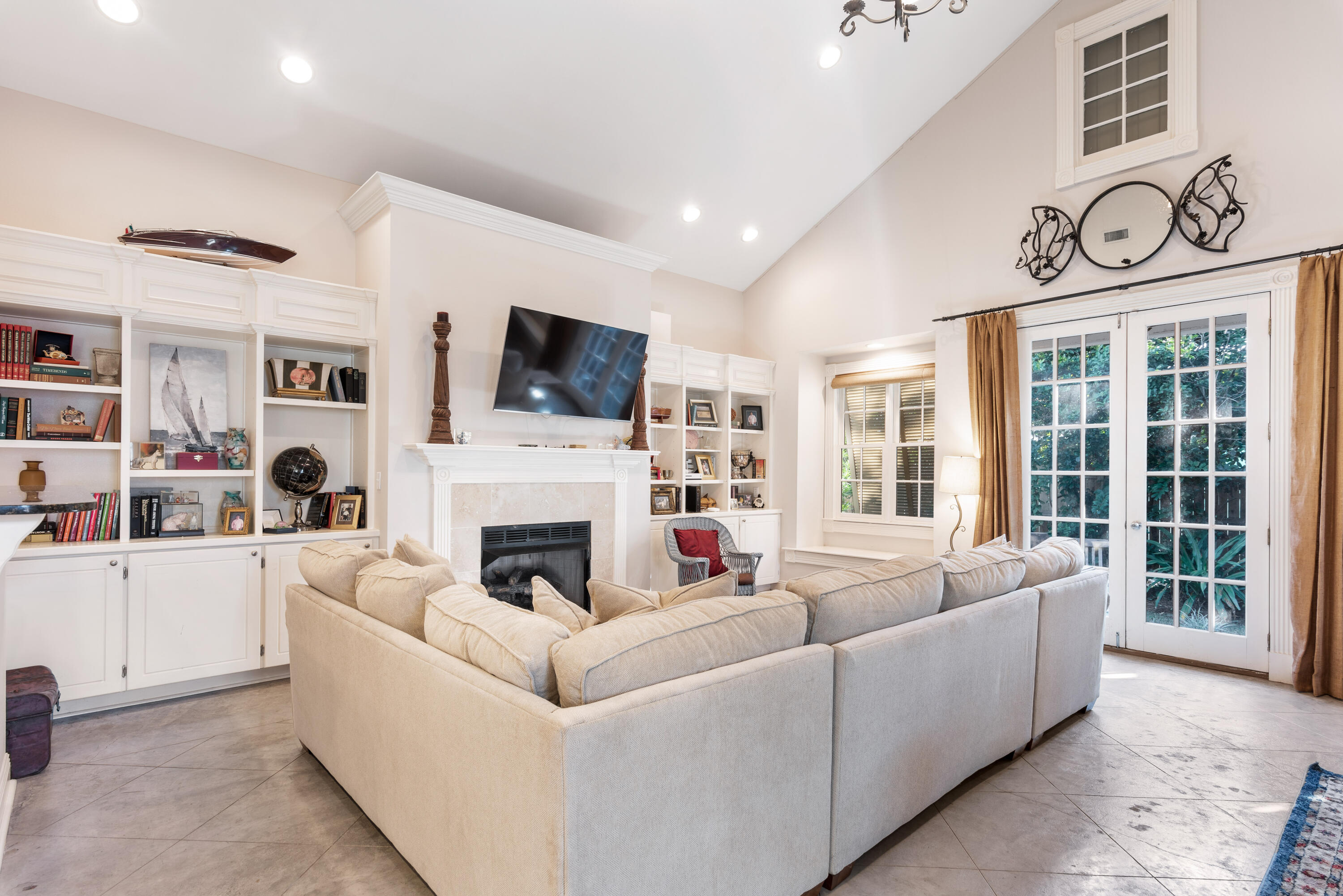 51 Rue Caribe Miramar Beach, FL 32550 - Photo 14 of 41 a living room with furniture a fireplace and a flat screen tv
