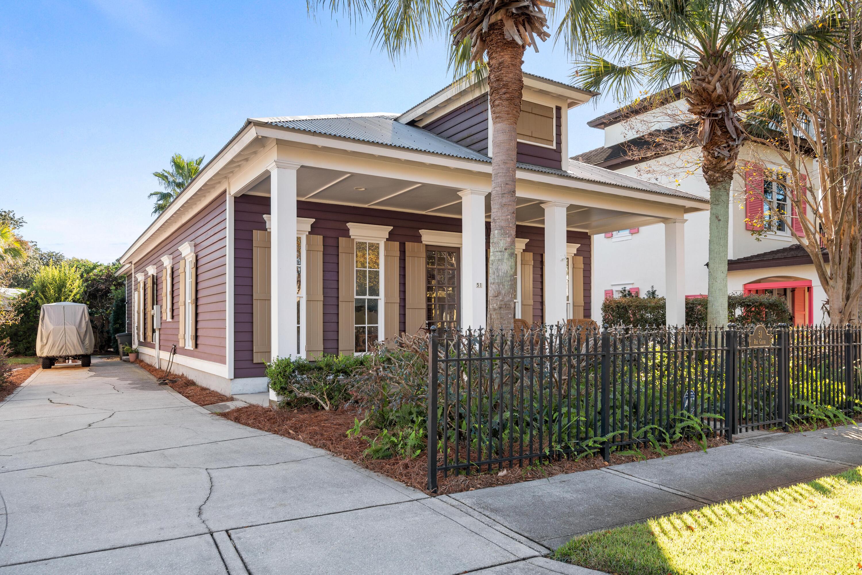 51 Rue Caribe Miramar Beach, FL 32550 - Photo 2 of 41 a view of a house with a garden
