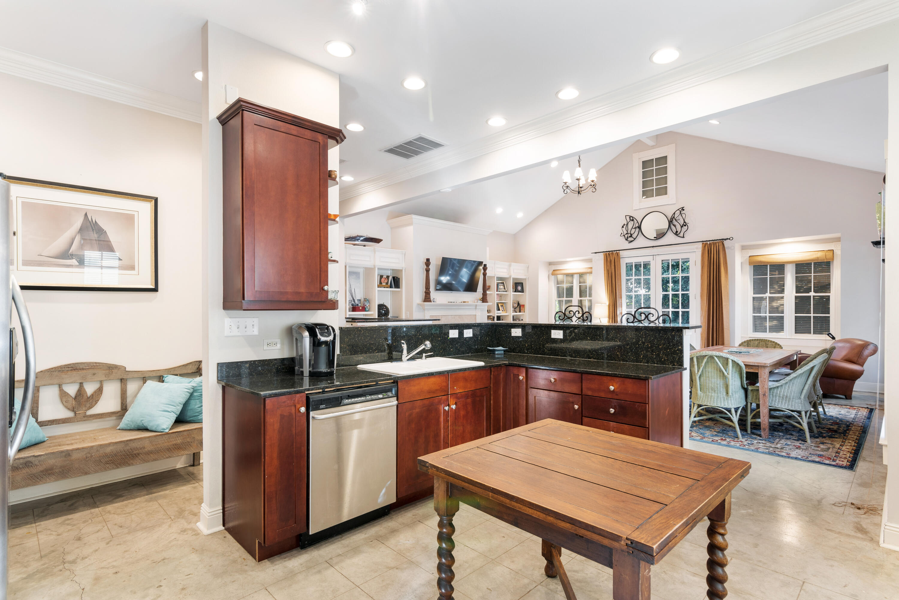 51 Rue Caribe Miramar Beach, FL 32550 - Photo 21 of 41 a kitchen with stainless steel appliances granite countertop a table chairs stove and sink