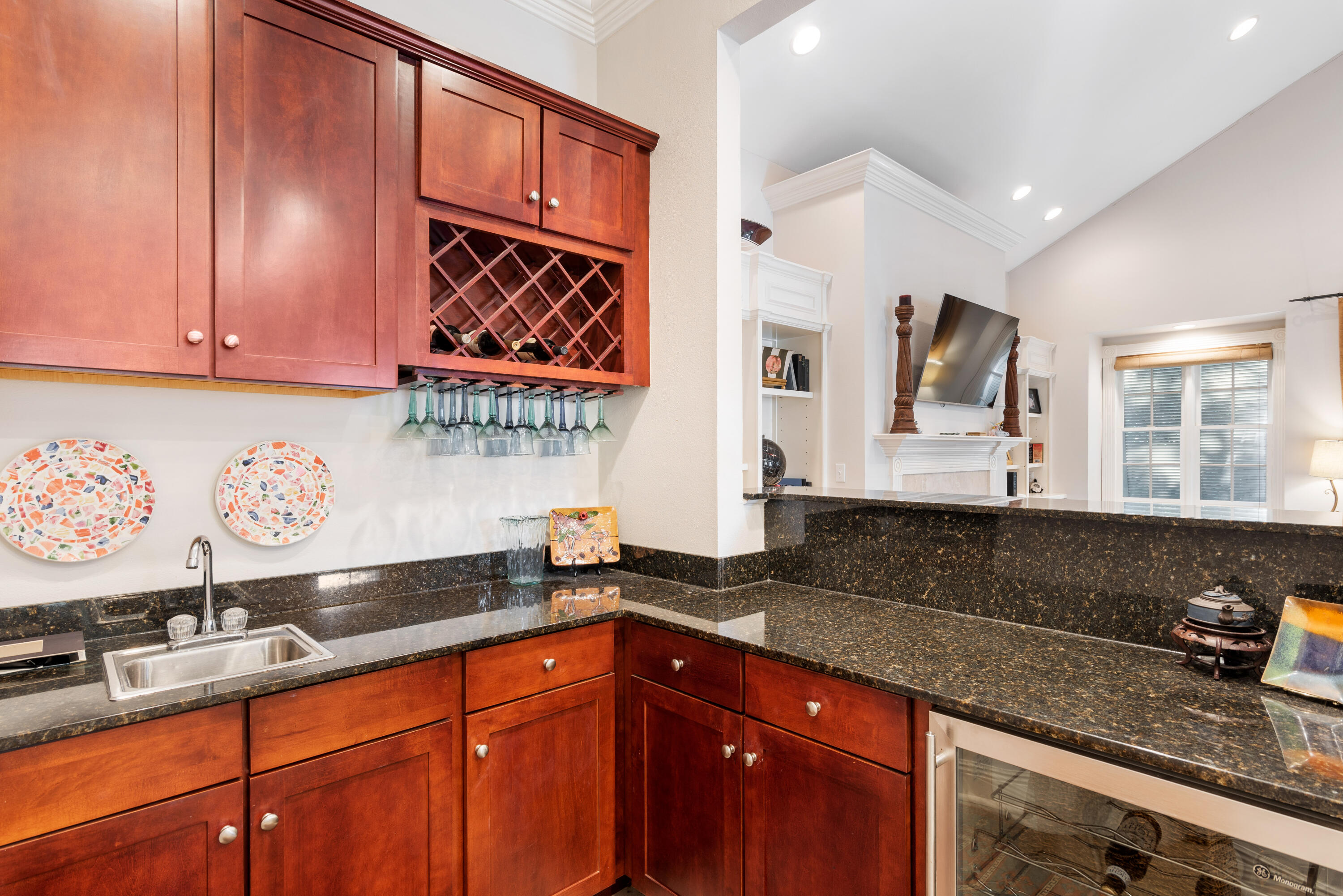 51 Rue Caribe Miramar Beach, FL 32550 - Photo 22 of 41 a kitchen with granite countertop a sink a stove and cabinets