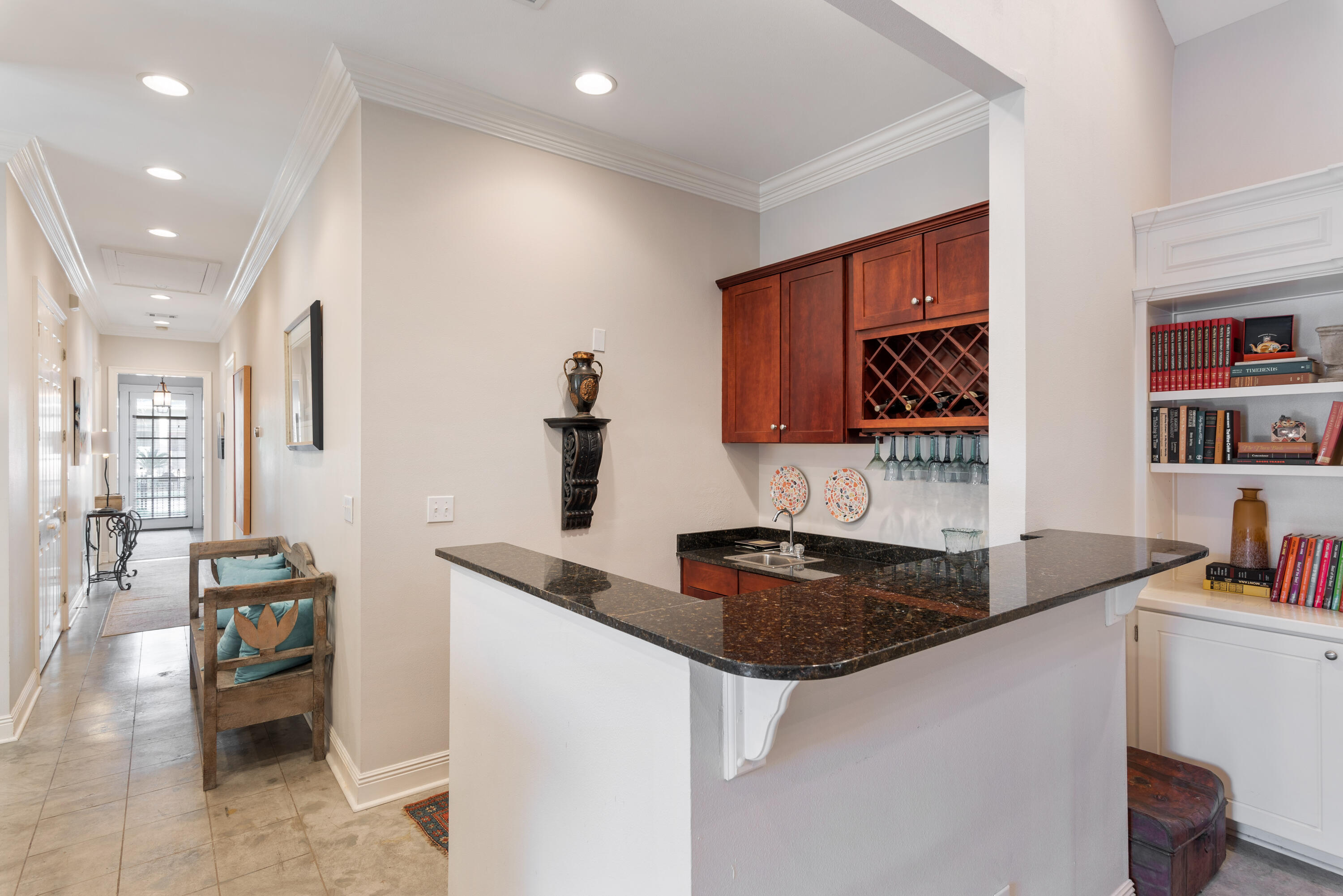 51 Rue Caribe Miramar Beach, FL 32550 - Photo 23 of 41 a kitchen with granite countertop a sink a stove and cabinets