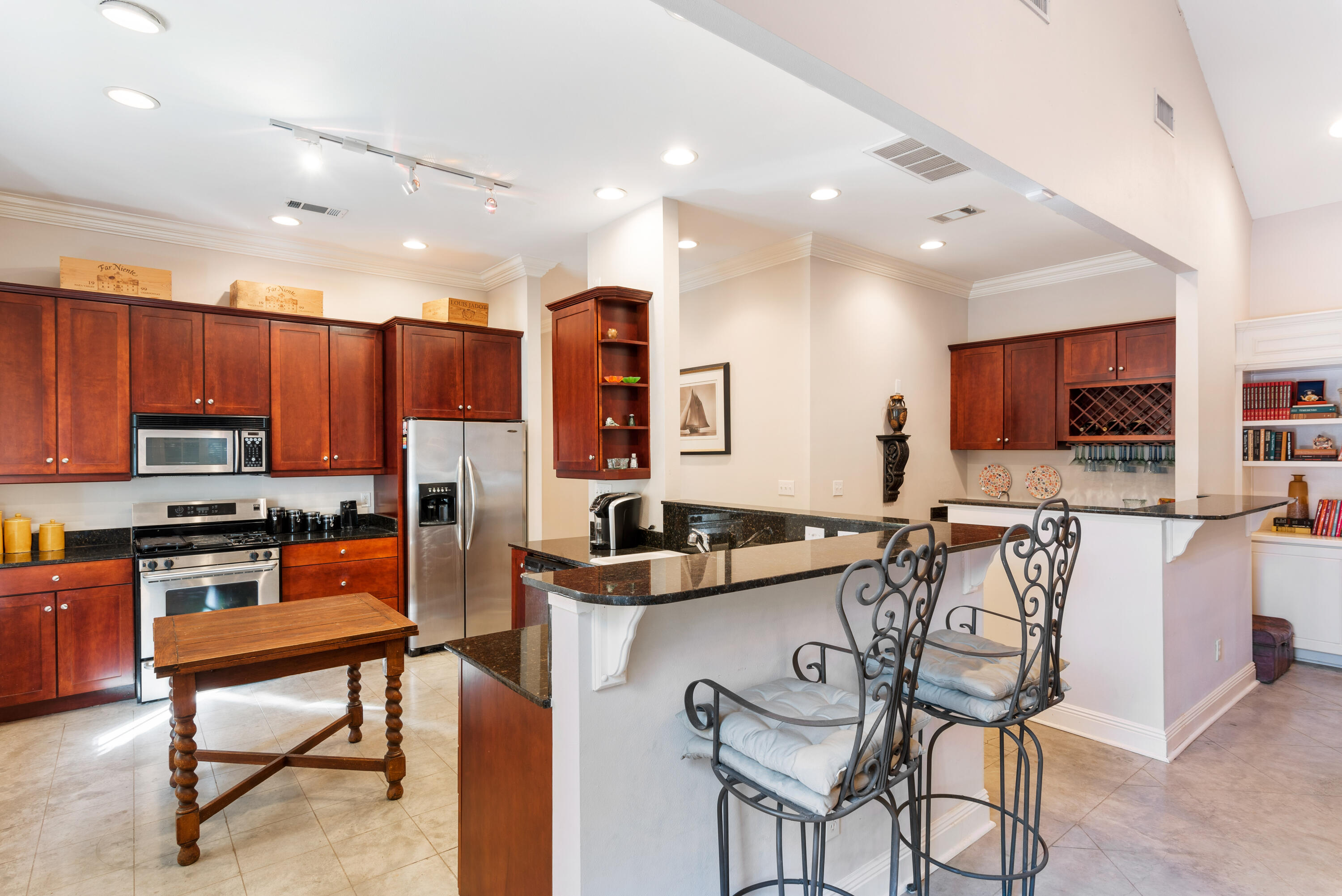 51 Rue Caribe Miramar Beach, FL 32550 - Photo 24 of 41 a kitchen with stainless steel appliances kitchen island granite countertop a sink and cabinets