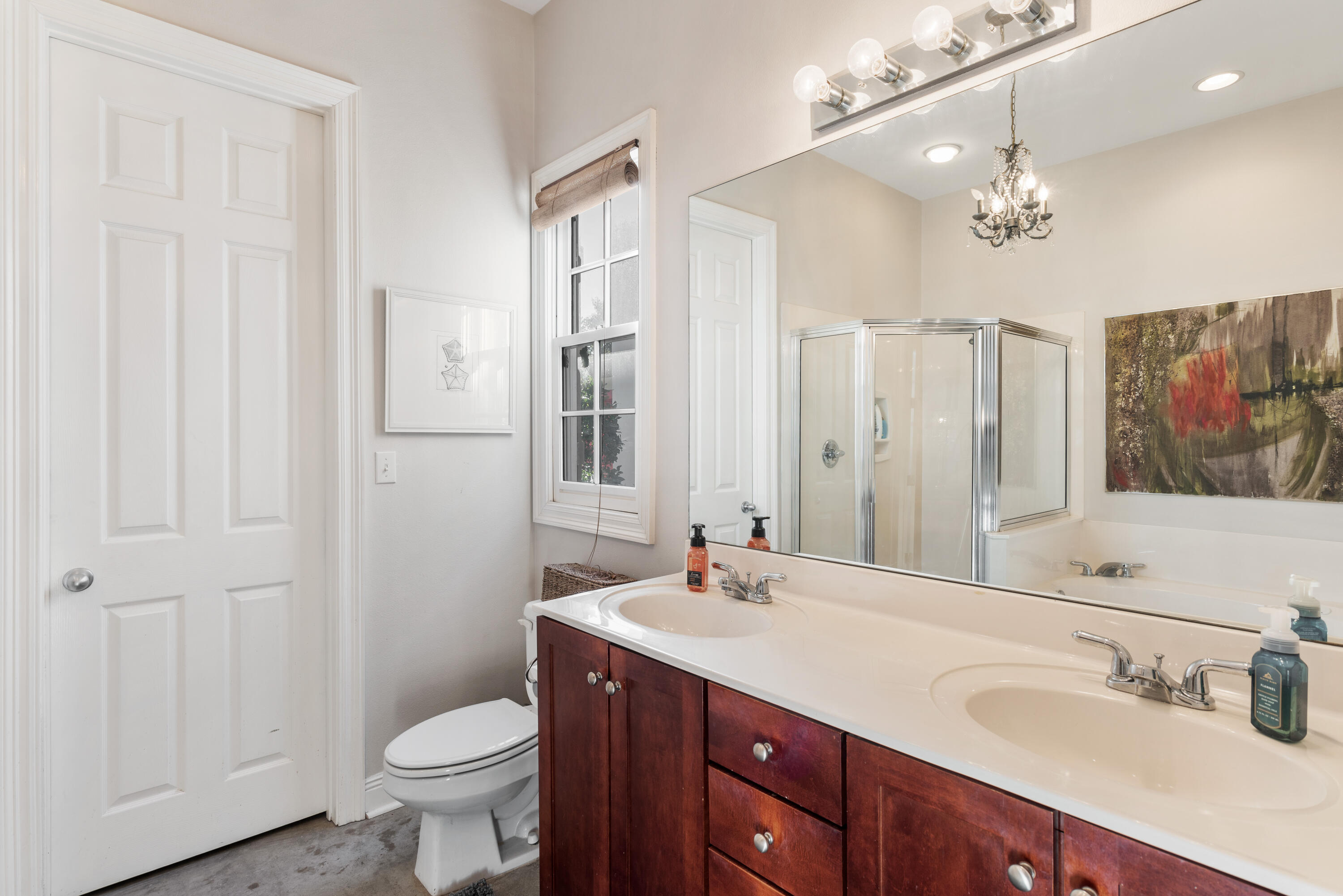 51 Rue Caribe Miramar Beach, FL 32550 - Photo 28 of 41 a bathroom with a double vanity sink a toilet and a mirror