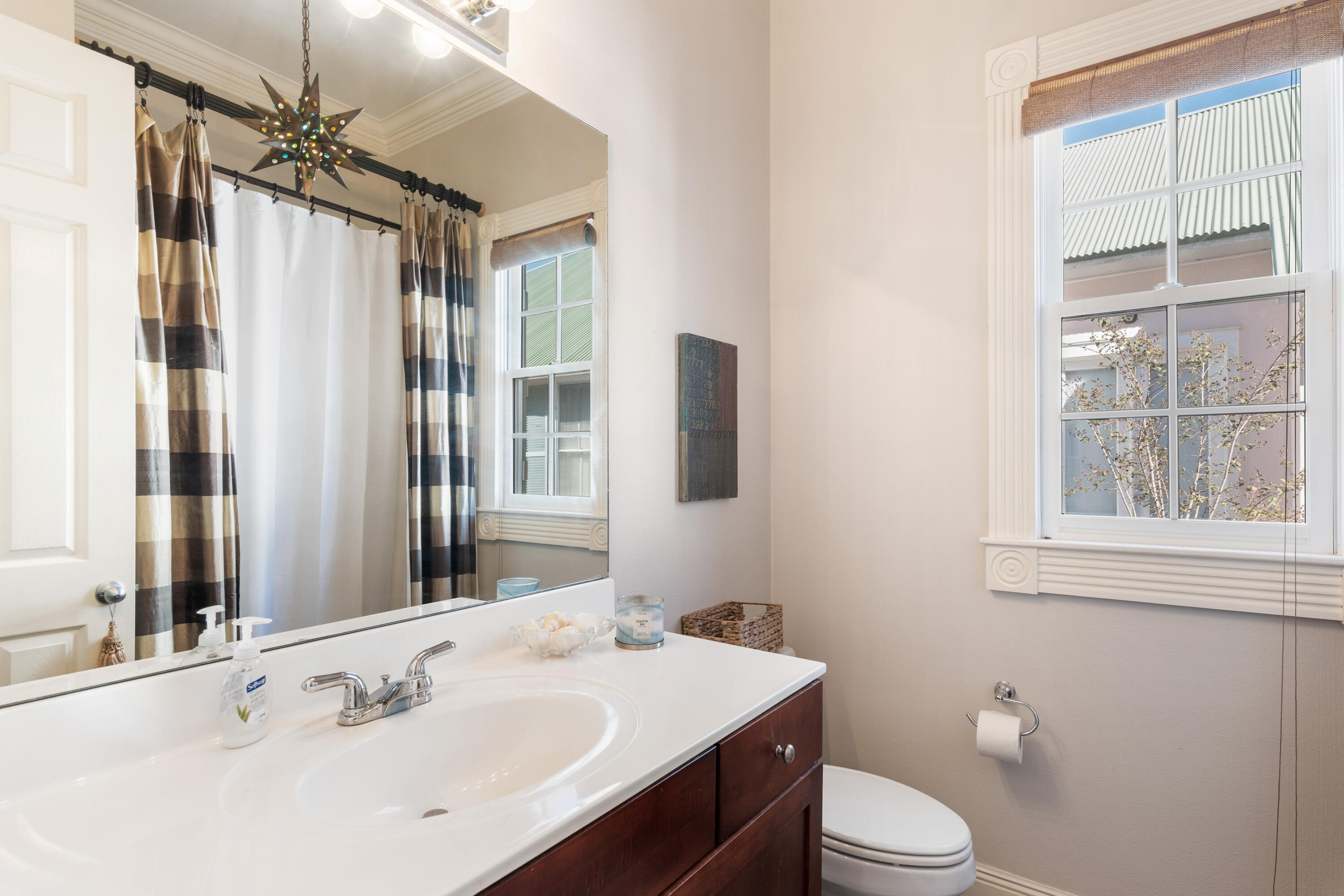 51 Rue Caribe Miramar Beach, FL 32550 - Photo 34 of 41 a bathroom with a sink a toilet a mirror and shower
