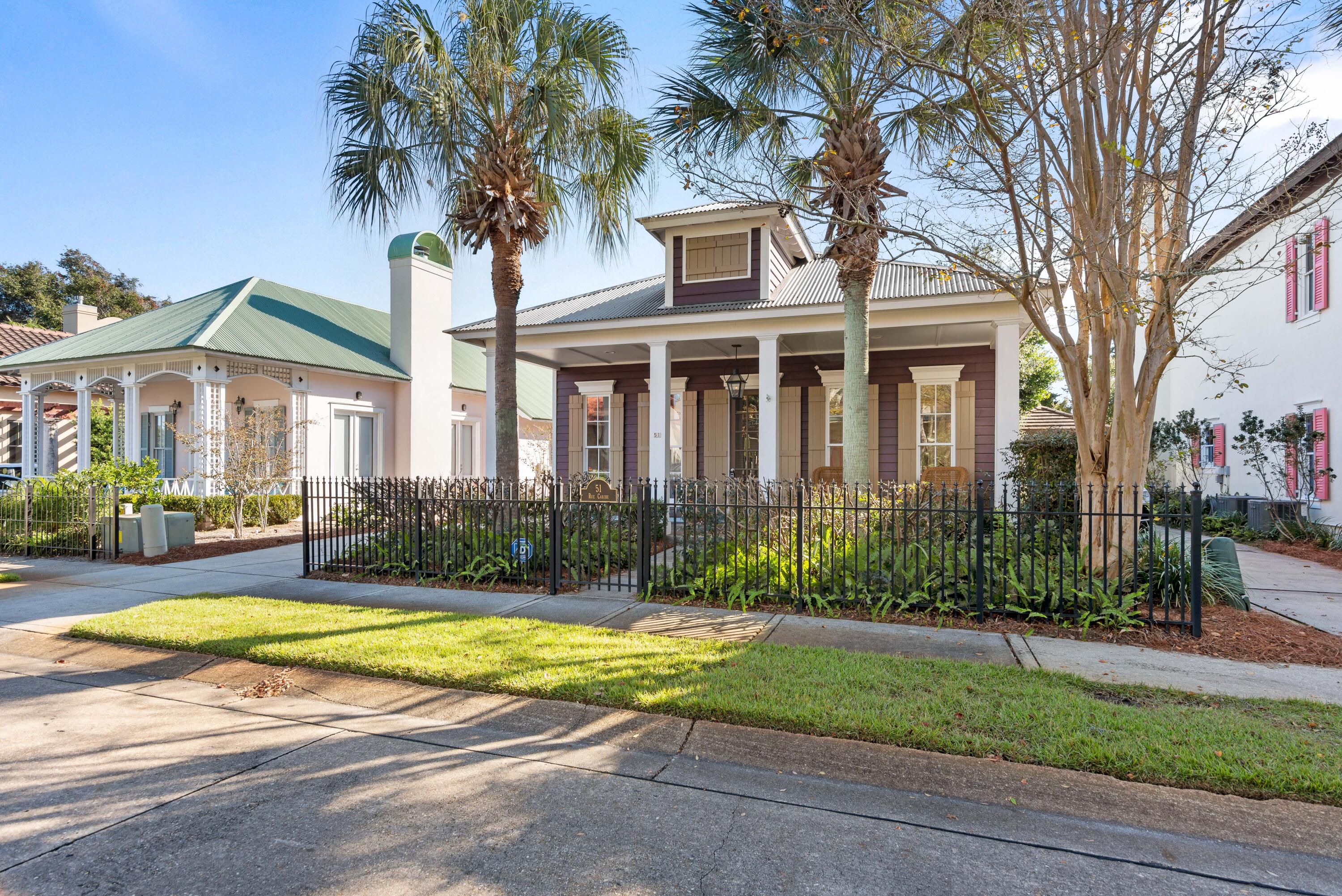 51 Rue Caribe Miramar Beach, FL 32550 - Photo 5 of 41 a view of a house with a swimming pool and a large tree