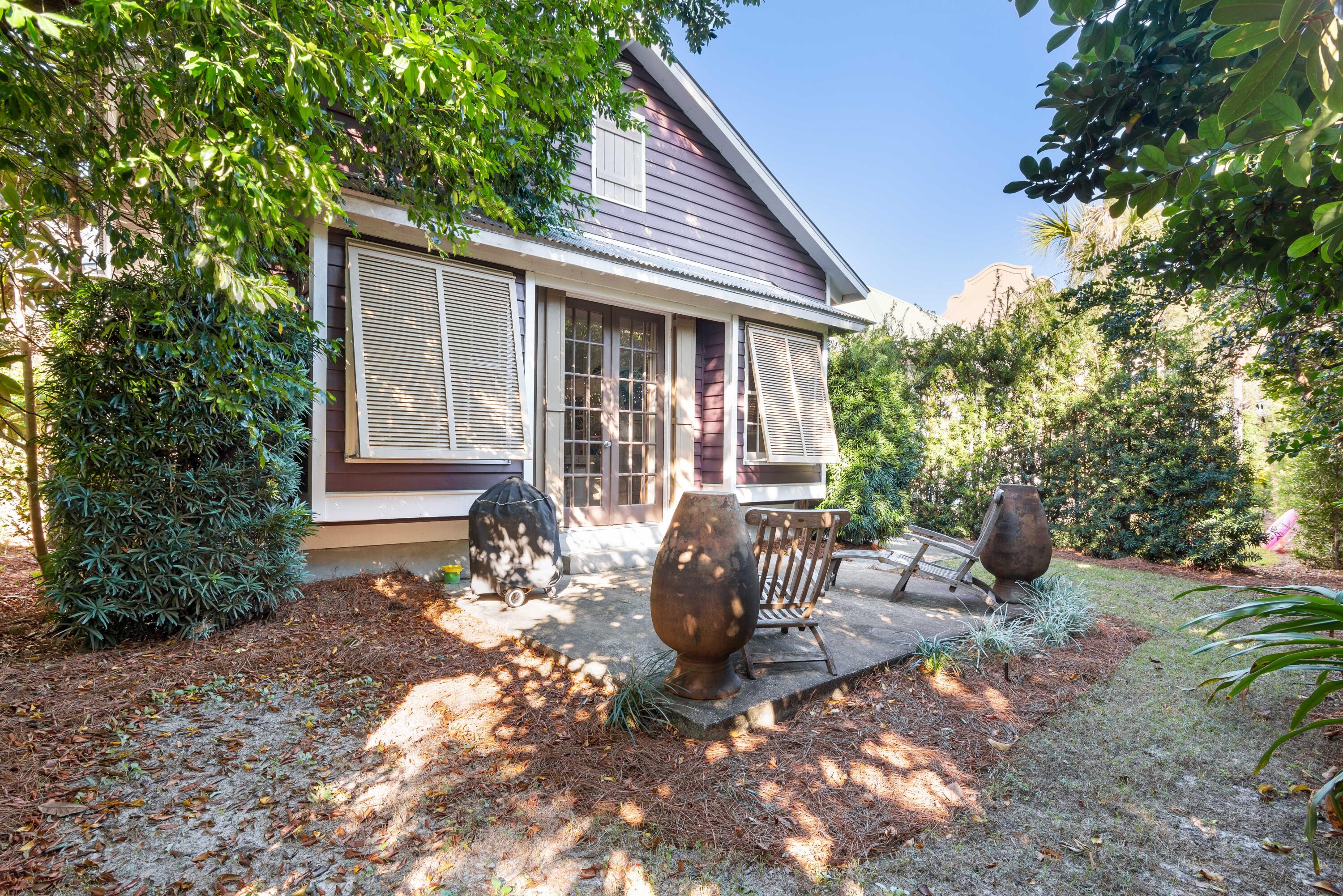51 Rue Caribe Miramar Beach, FL 32550 - Photo 9 of 41 a view of a house with backyard and sitting area