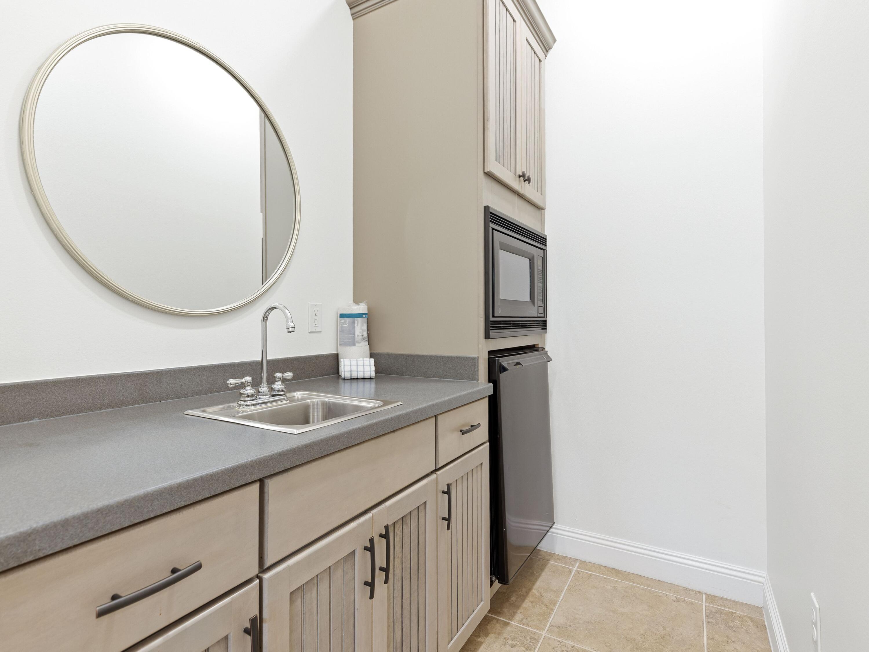 52 Tranquility Lane Destin, FL 32541 - Photo 15 of 65 a bathroom with a sink and a mirror