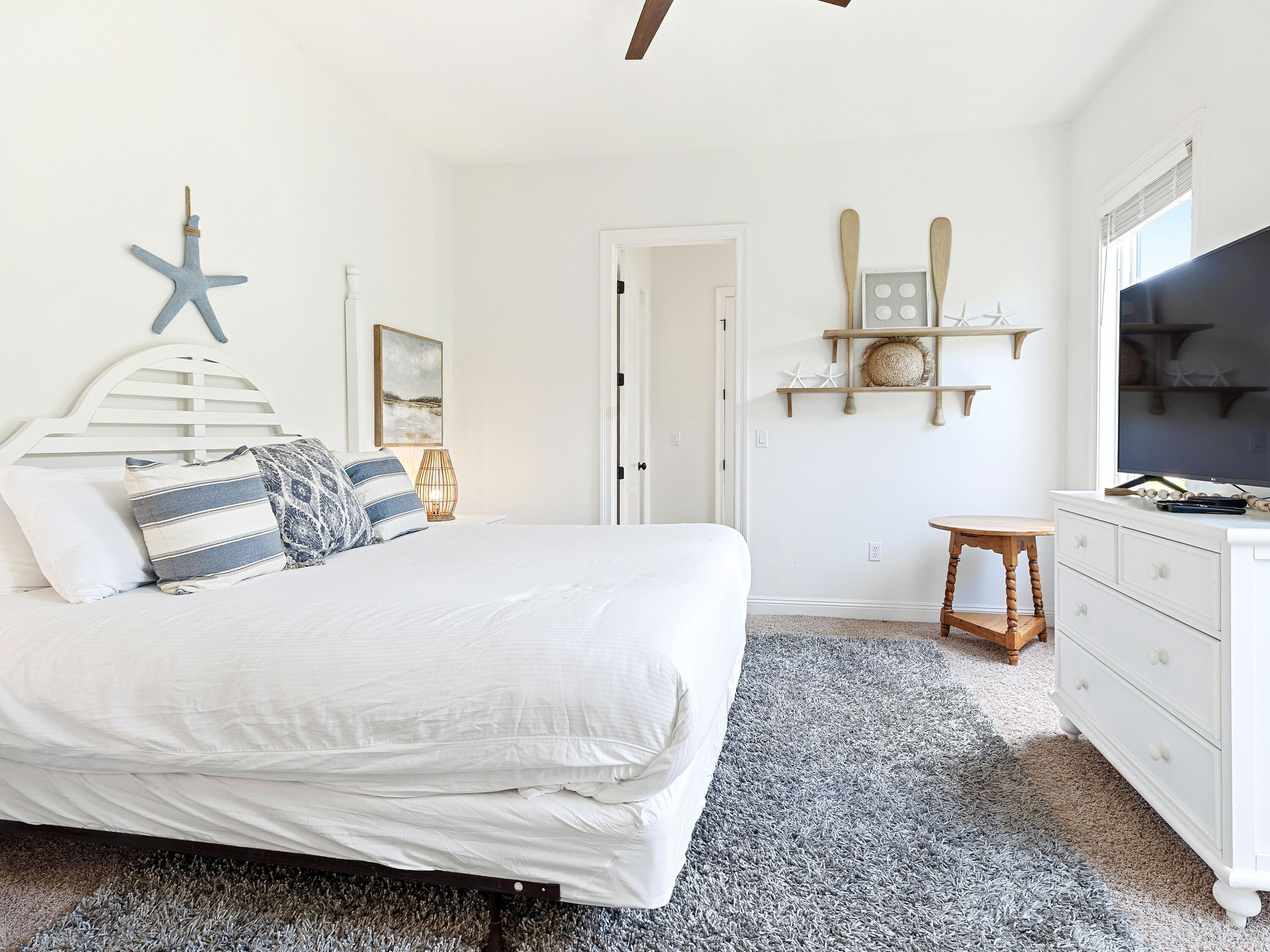 52 Tranquility Lane Destin, FL 32541 - Photo 22 of 65 a bedroom with a bed and a flat screen tv